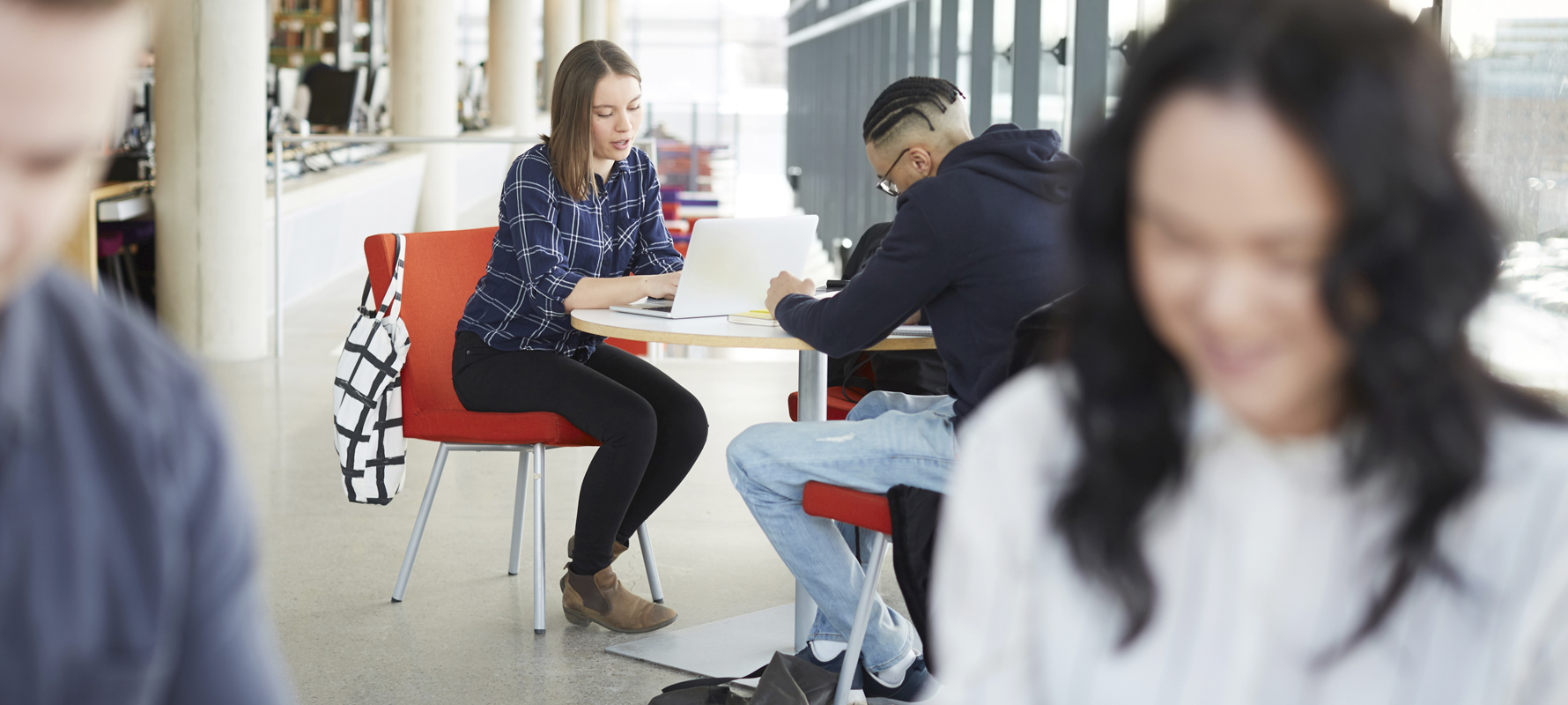 Students sit at the table and learn