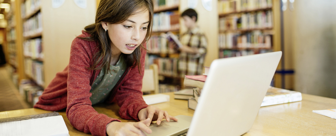 girl is checking facts on her computer