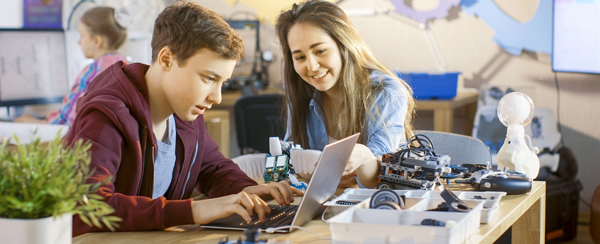 Students work with digital equipment at school.