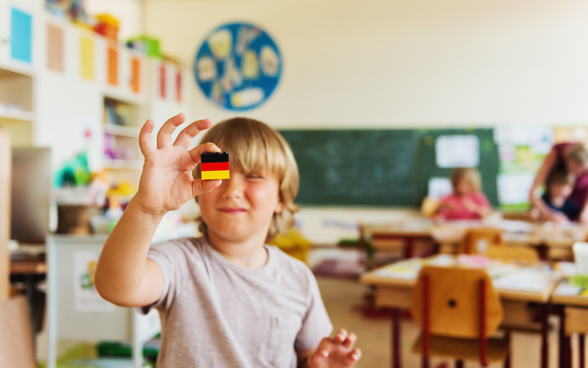 Boy in classroom playing with lego